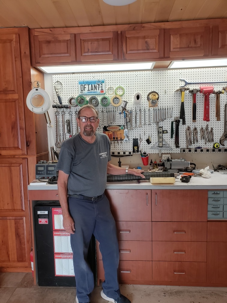 Rodney standing in his workshop