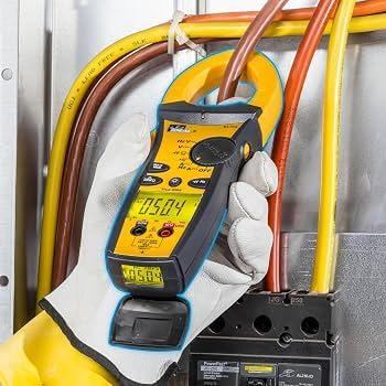 Electrical diagnostic testing with clamp meter on industrial machinery