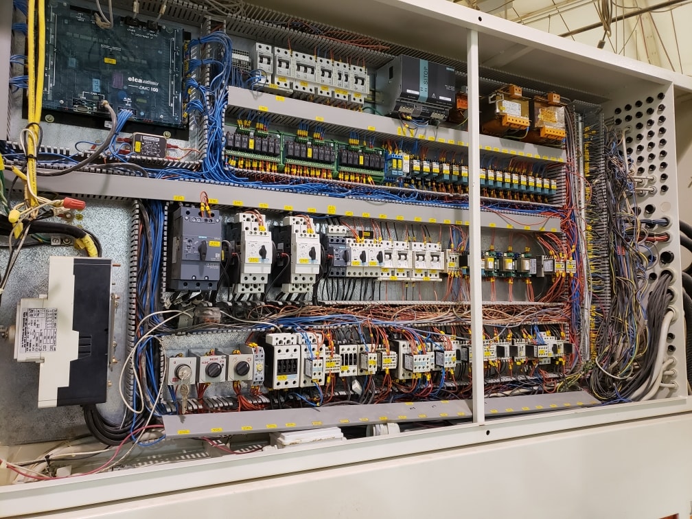 Industrial electrical control panel with circuit breakers and wiring